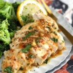 Garlic butter chicken sliced on plate