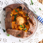 Overhead view of air fryer sweet potato on plate with hot honey butter