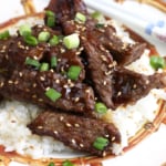 Beef teriyaki served over plate of rice