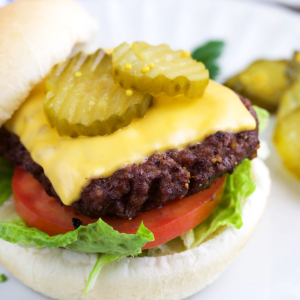 Air Fryer burger on a bun with lettuce pickles and tomato