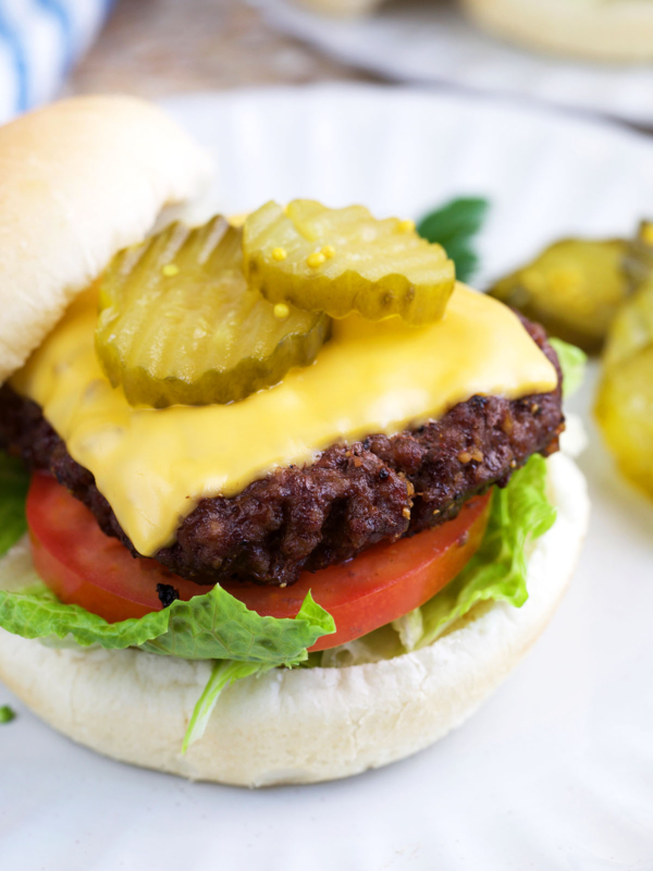 Air Fryer burger on a bun with lettuce pickles and tomato
