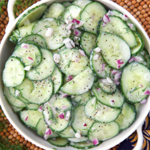 German Cucumber Salad in a small white bowl.