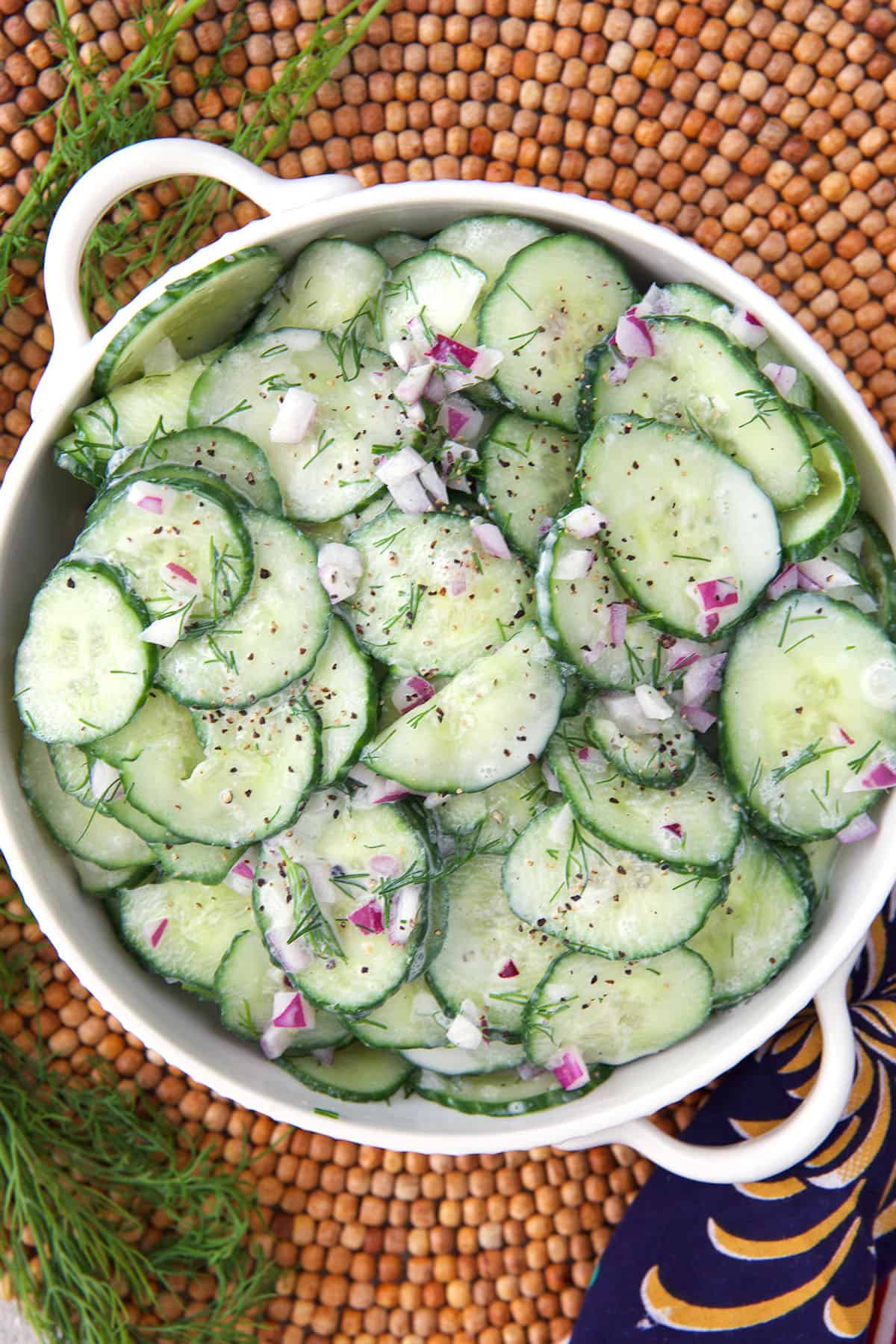 German Cucumber Salad in a small white bowl.