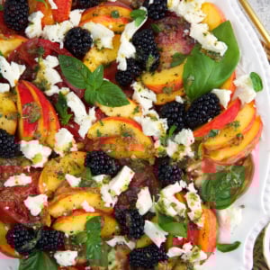 Peach Caprese Salad on a white platter