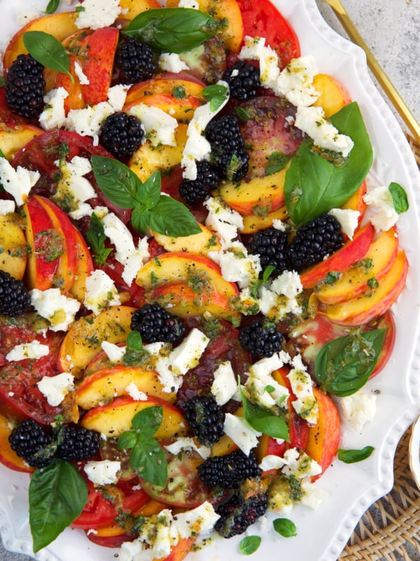 Peach Caprese Salad on a white platter