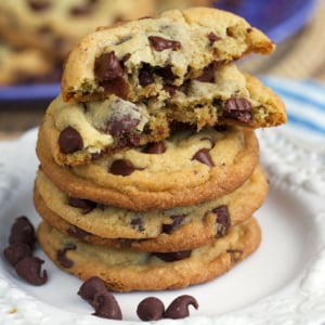 Best chocolate chip cookies stacked on a cupcake stand with a crumb shot.
