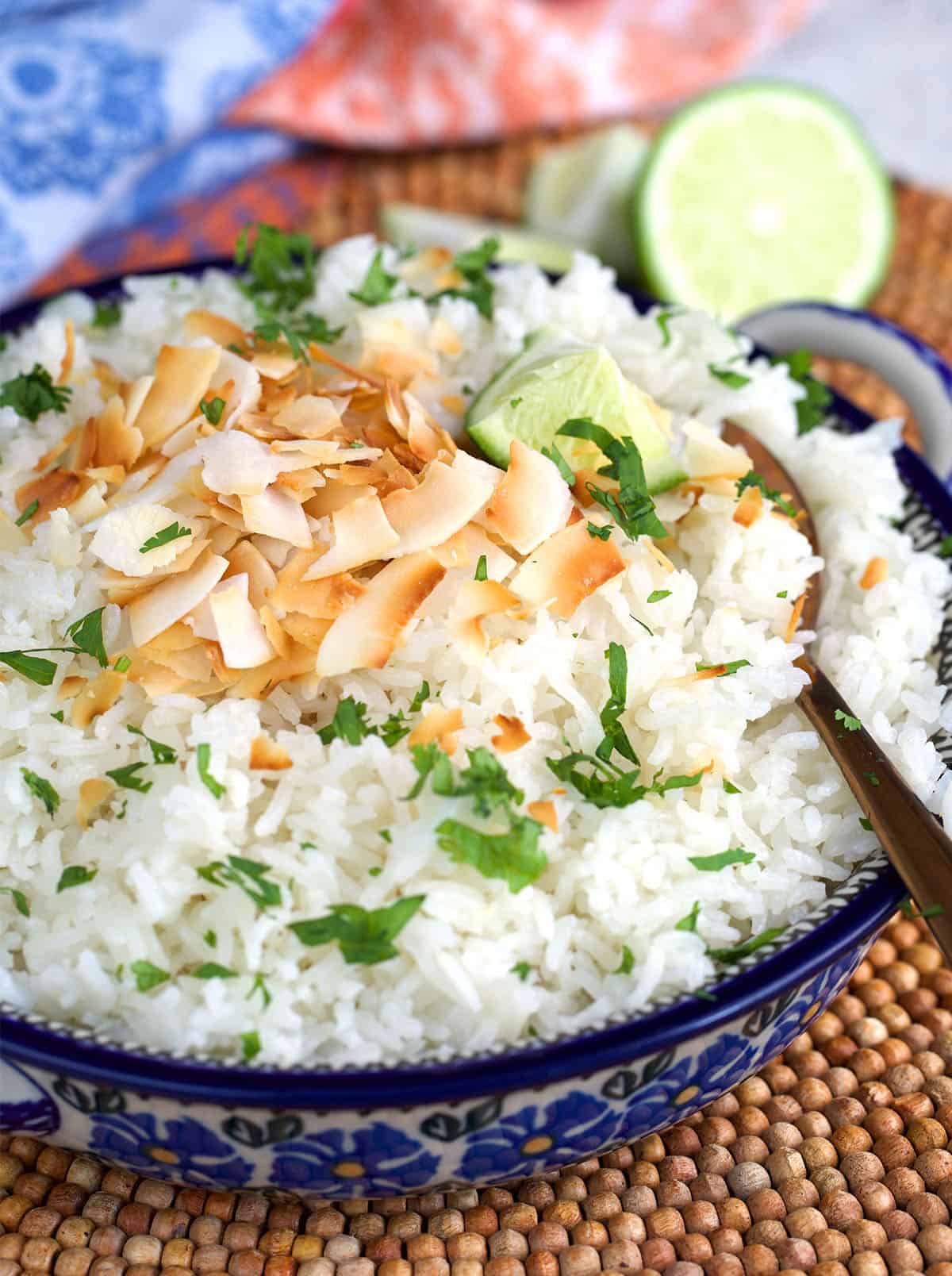 Coconut rice in polish pottery with toasted coconut and cilantro on top