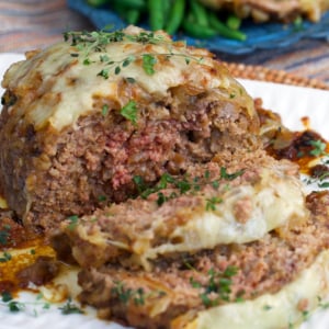 French Onion Meatloaf sliced on a white platter