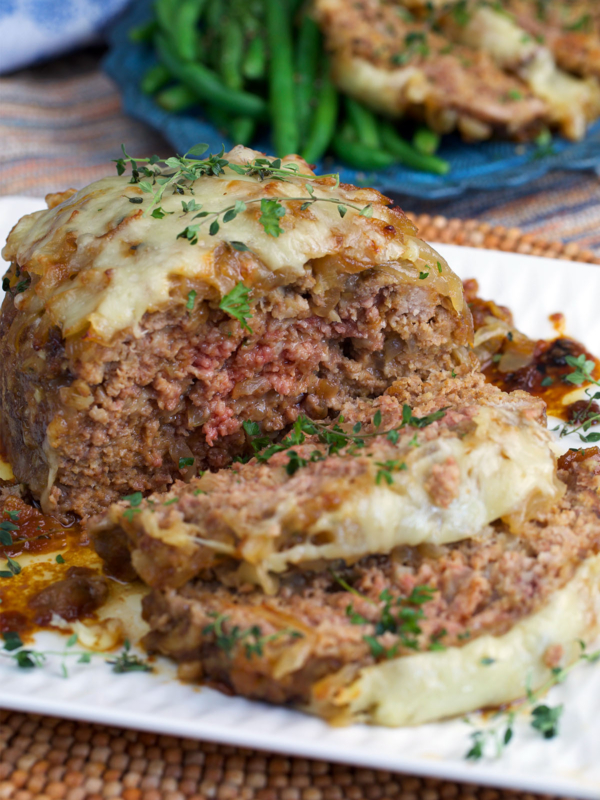 French Onion Meatloaf sliced on a white platter