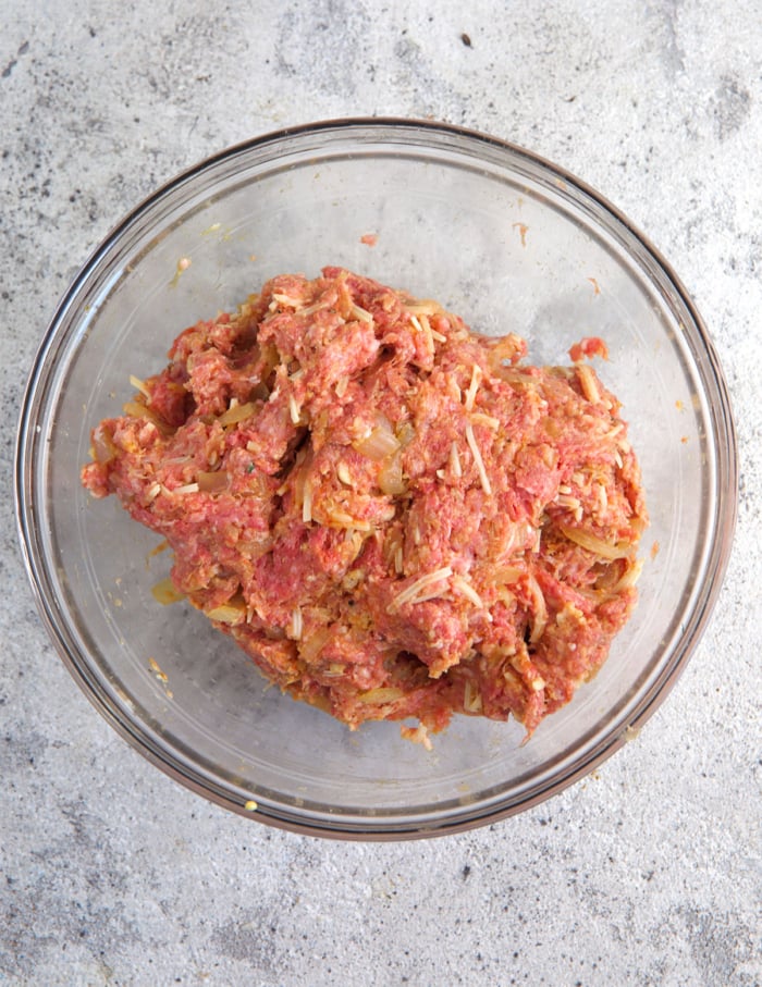 meat mixture mixed together in a glass bowl.