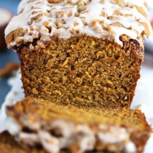 Pumpkin Banana Bread with glaze on a streusel topping.