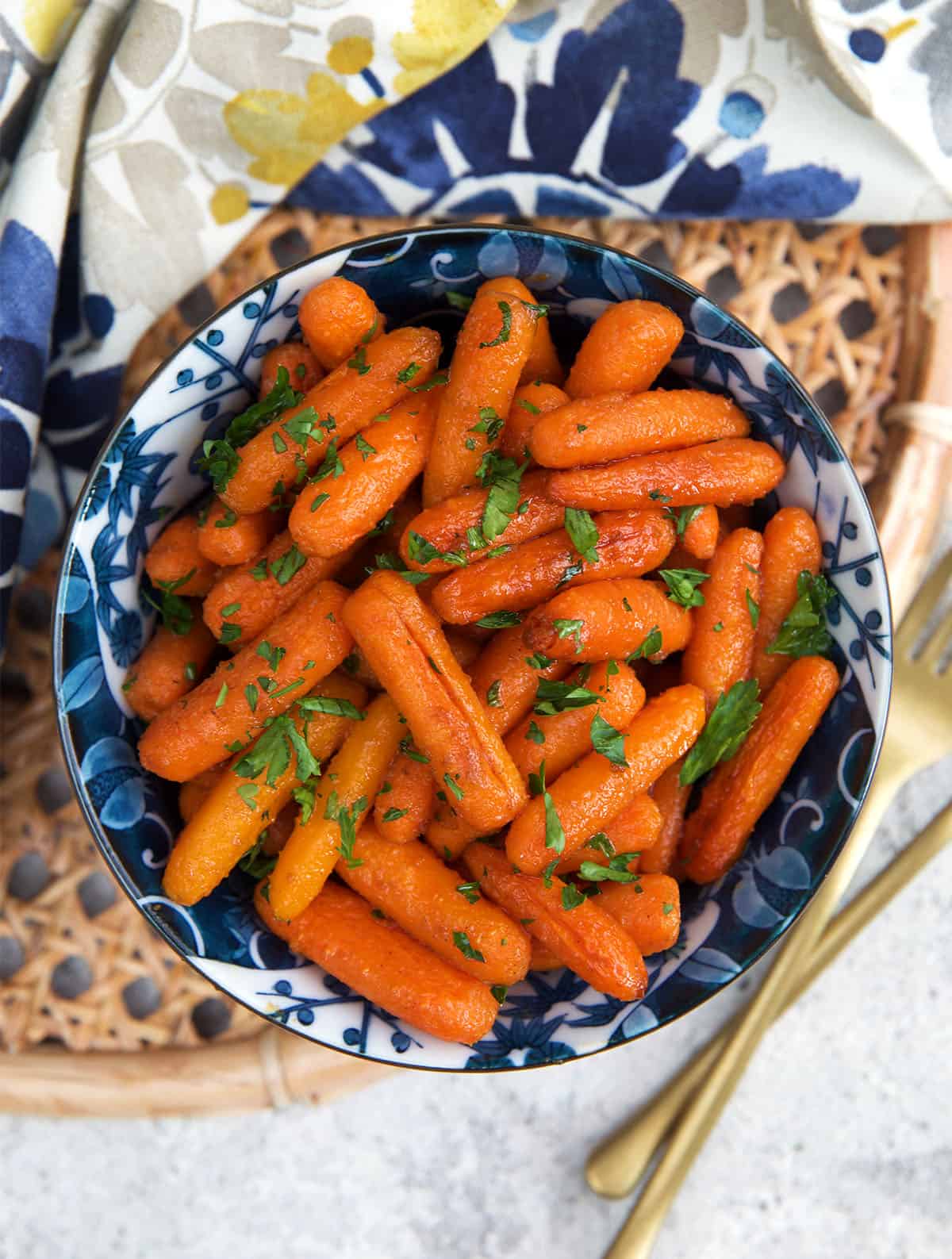 Oven Roasted Baby Carrots in a blue and white serving bowl