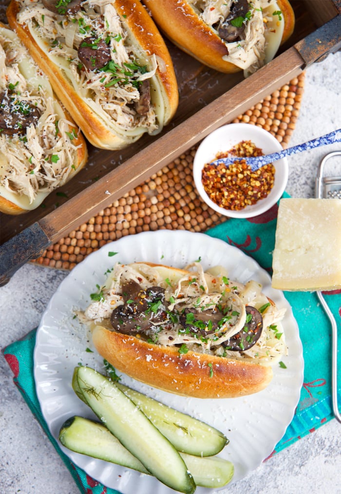 Chicken cheesesteak on a plate with pickles