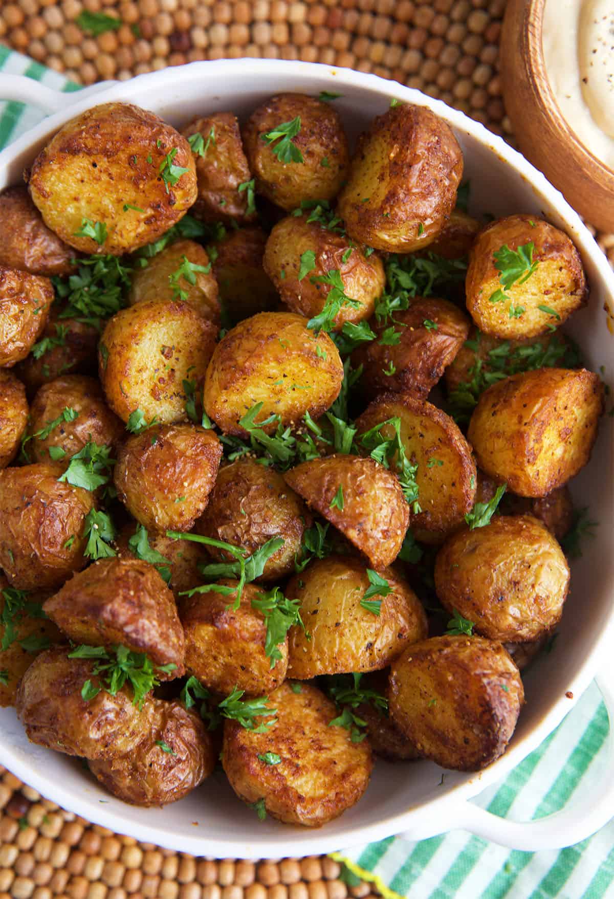 Air Fryer Roasted Potatoes in a white bowl for serving.