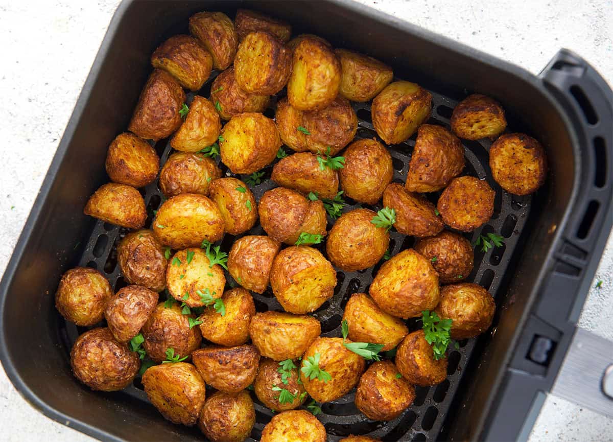 Air Fryer Roasted Potatoes in an air fryer basket after being cooked