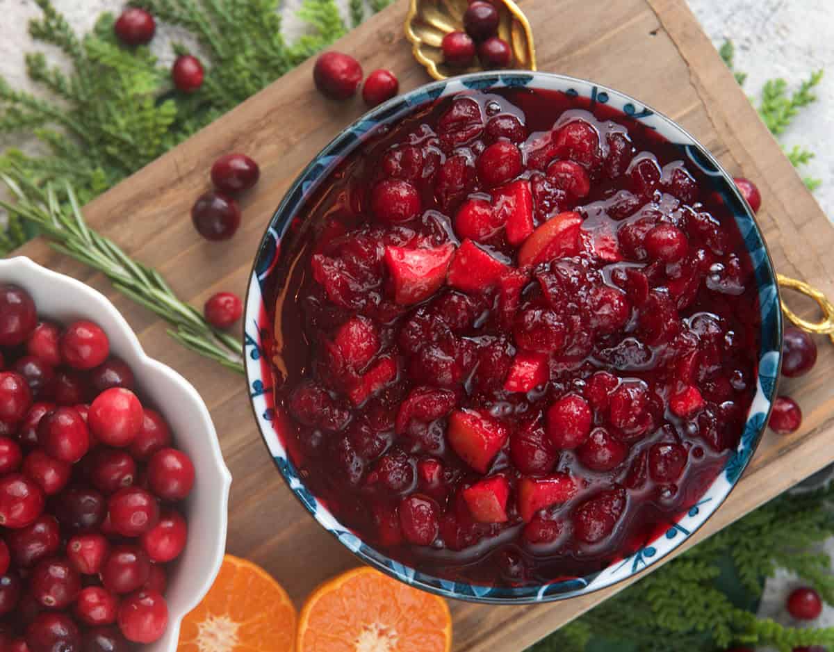 cranberry sauce in a blue and white serving bowl on a board