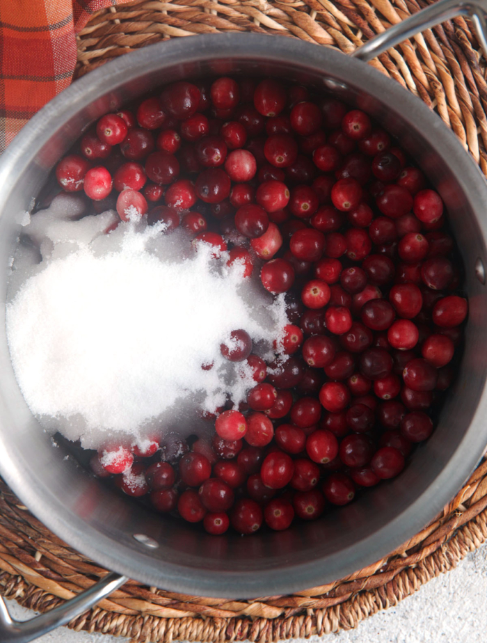 cranberries and sugar in a saucepan