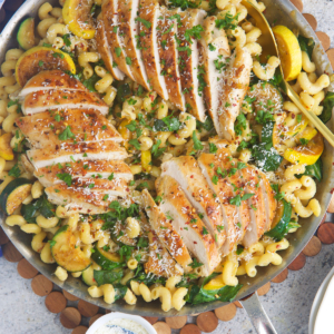 Lemon Chicken Pasta in a stainless skillet ready to serve dinner.