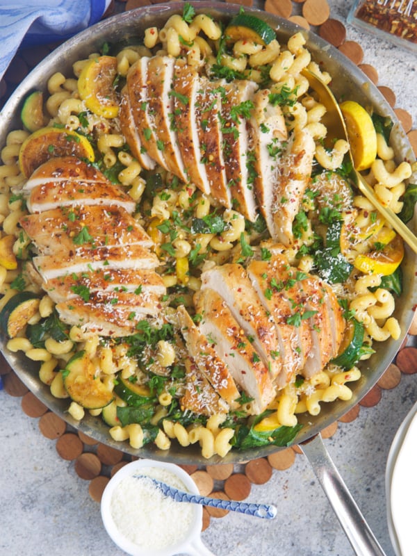 Lemon Chicken Pasta in a stainless skillet ready to serve dinner.