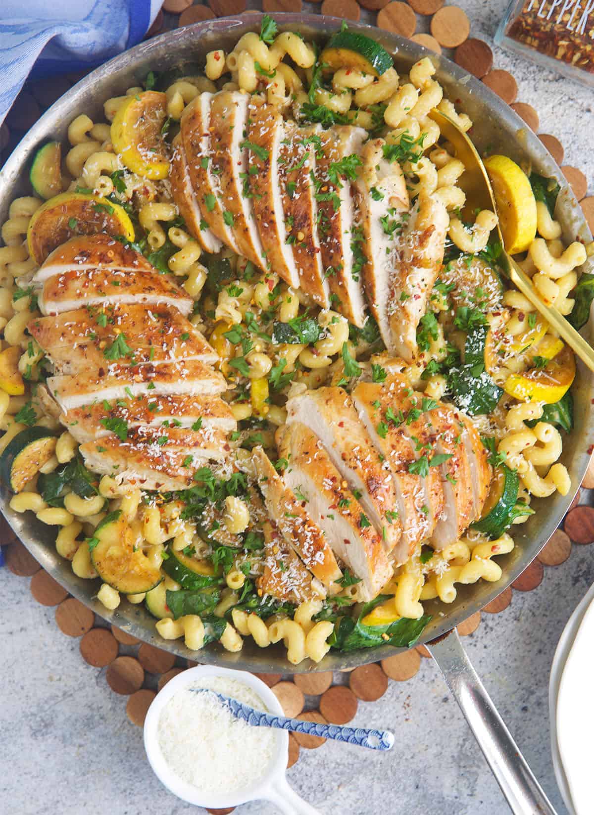 Lemon Chicken Pasta in a stainless skillet ready to serve dinner.