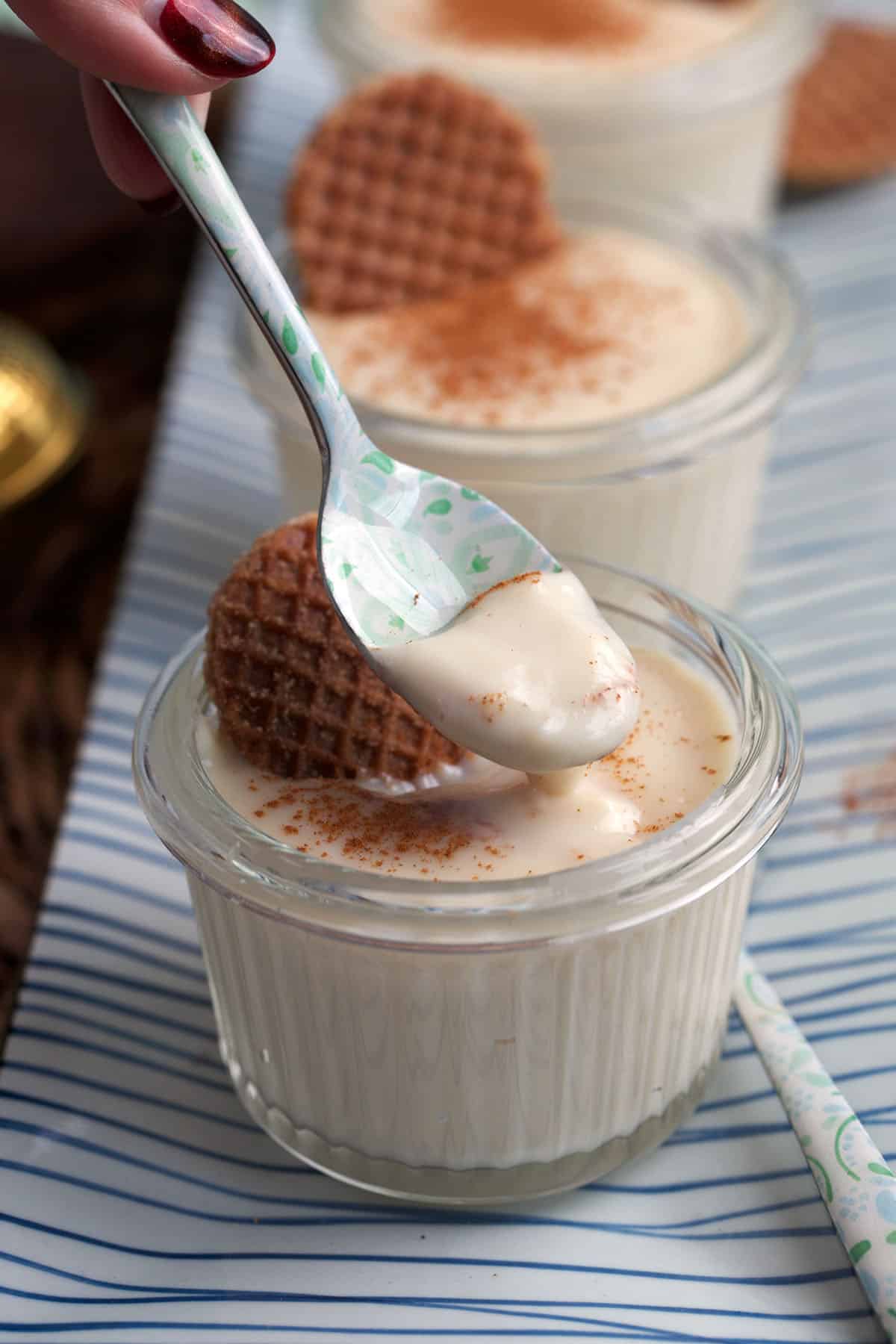 Vanilla pudding with a spoon 