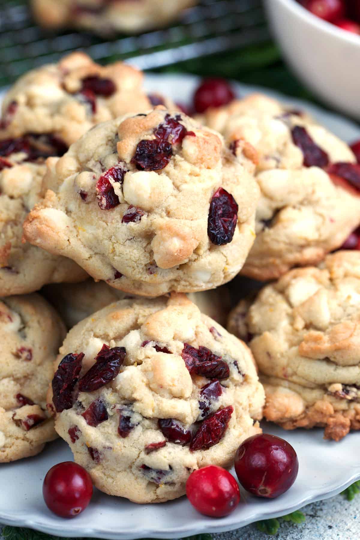 White Chocolate Cranberry Cookies piled on a white plate.