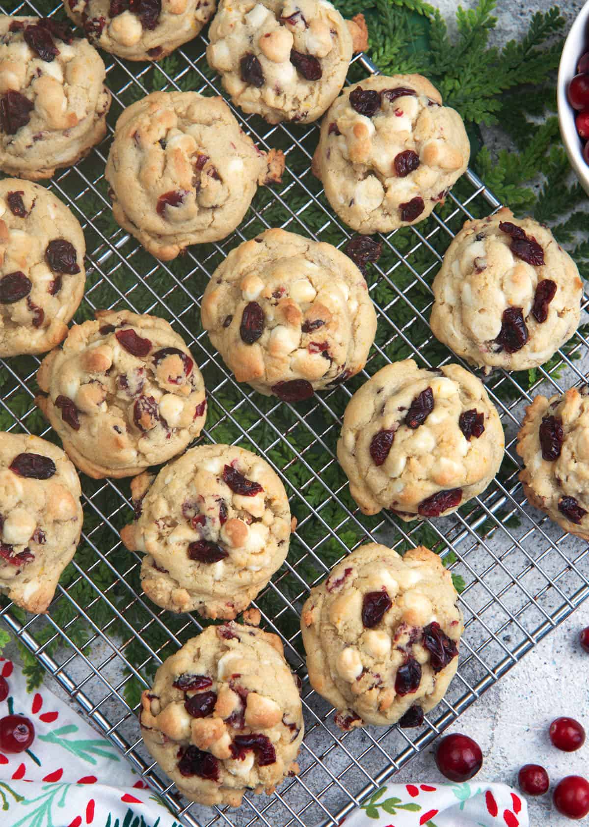 White chocolate cranberry cookies cooling on a wire rack
