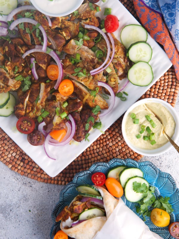Sheet pan chicken shawarma on a white platter