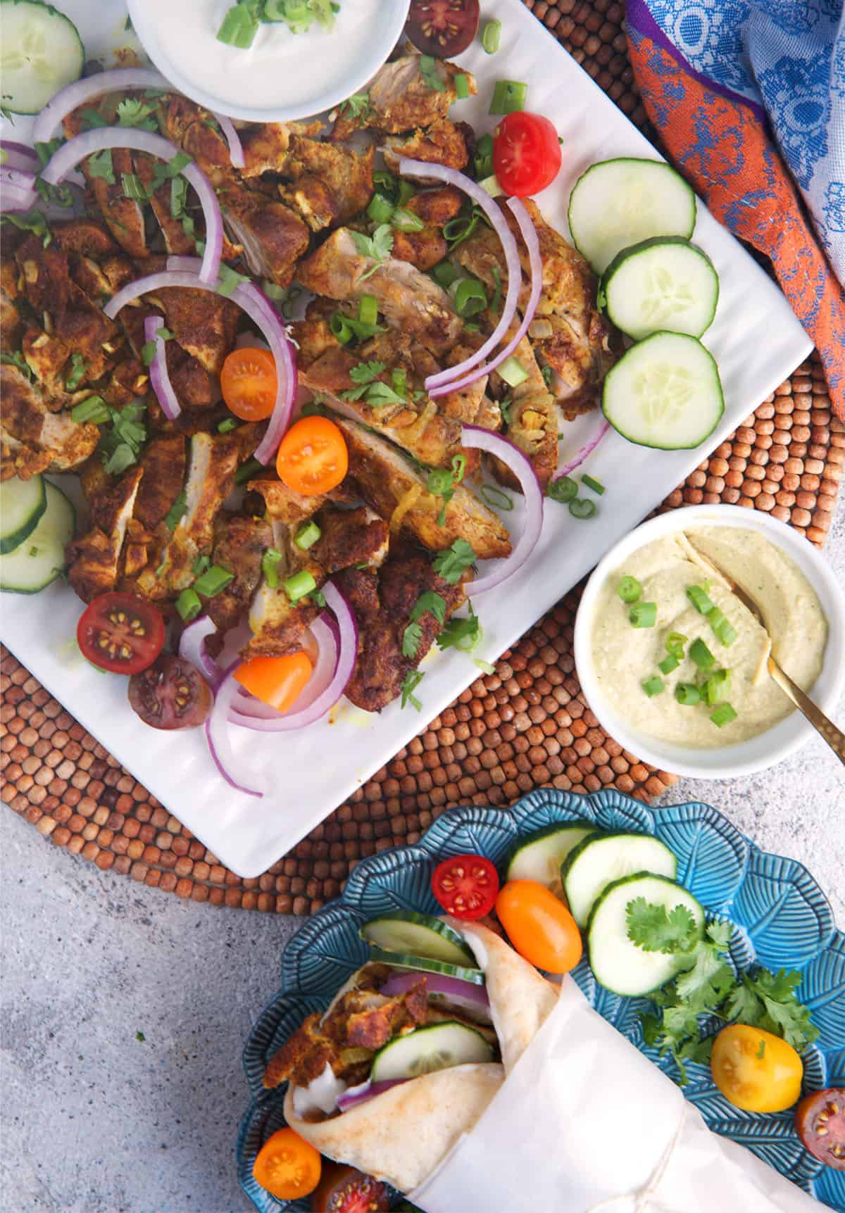 Sheet pan chicken shawarma on a white platter