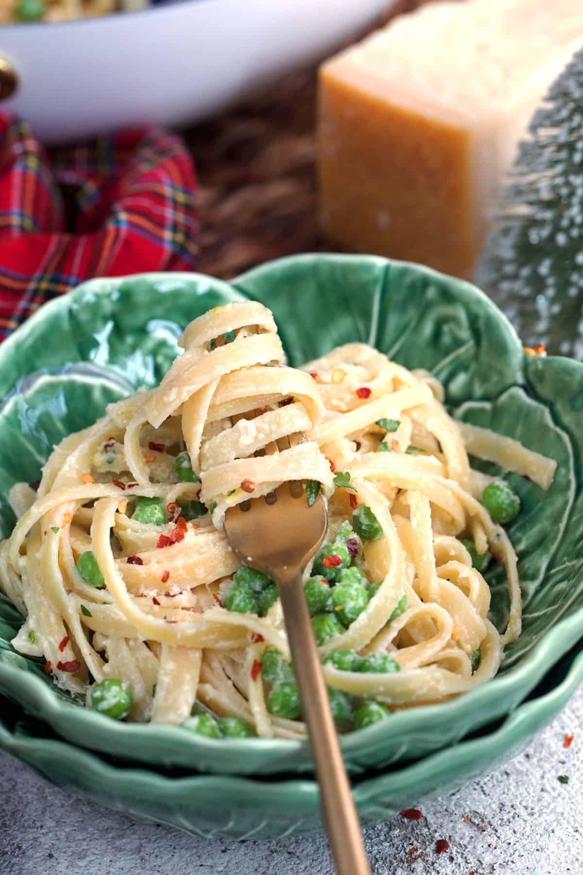 Christmas Fettuccine in a cabbage bowl with a gold fork.