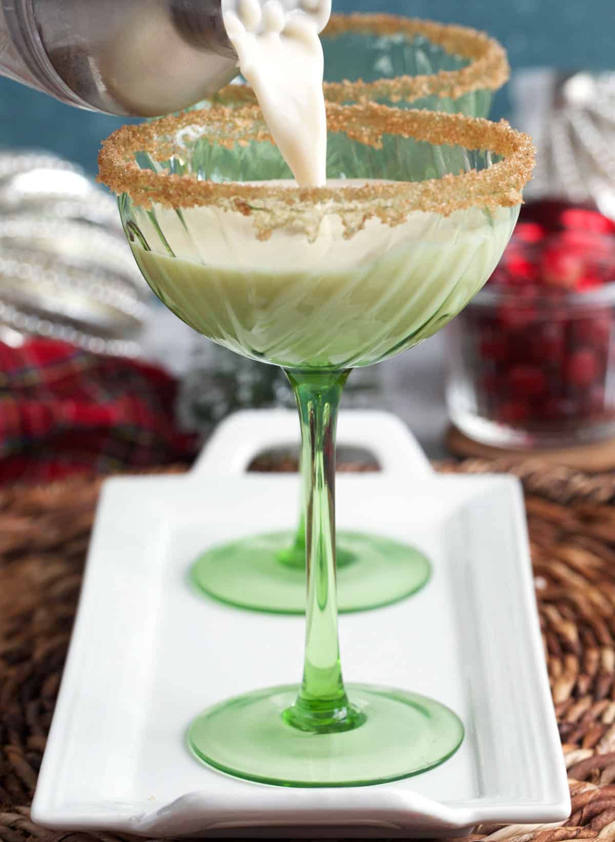 Eggnog martini being poured into a glass