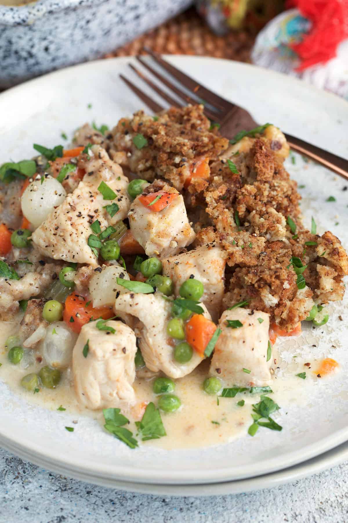 Chicken and Stuffing Casserole with stove top stuffing on a white plate