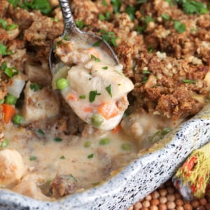 chicken and Stuffing casserole with a serving spoon