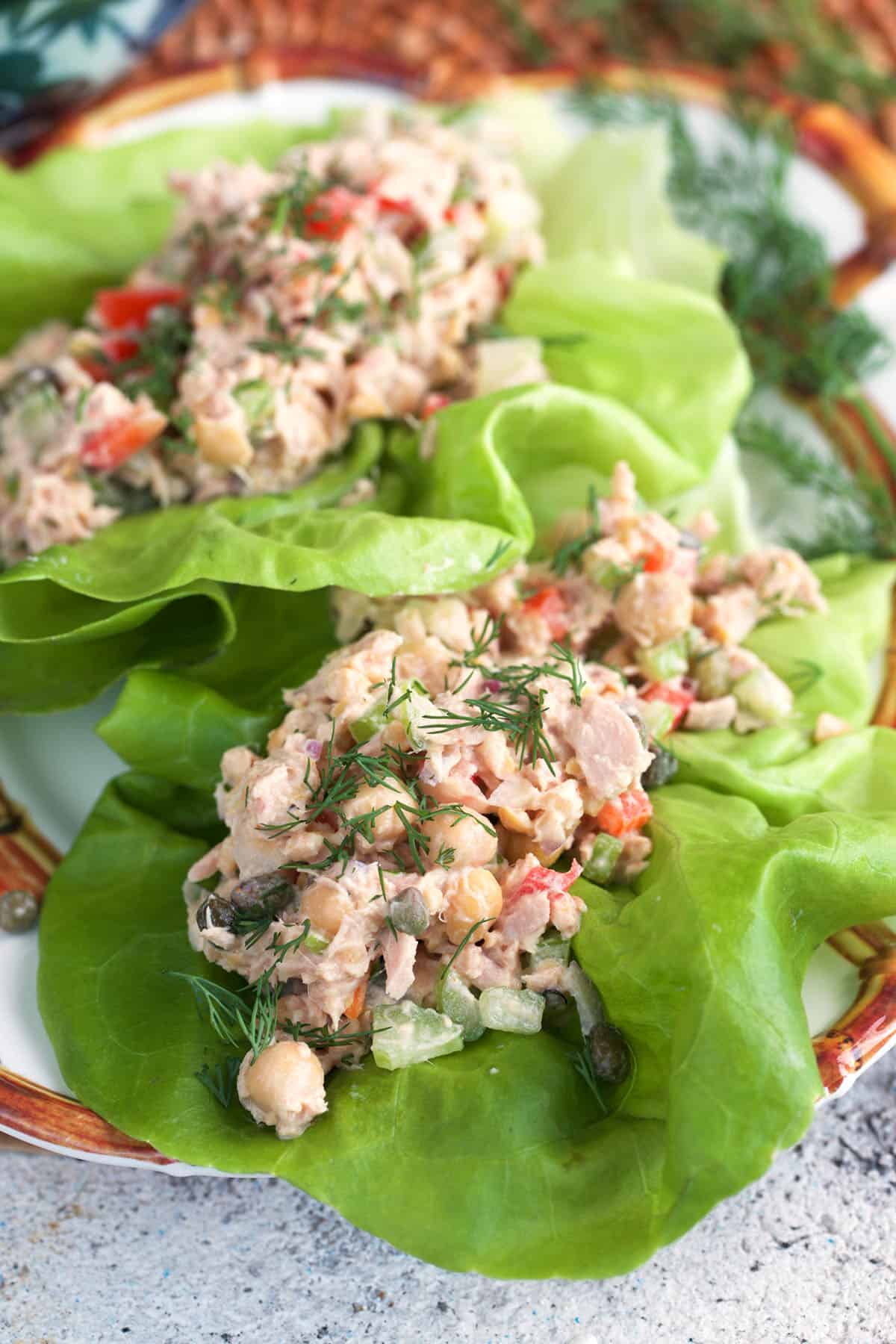 tuna chickpea salad lettuce wraps on a plate.