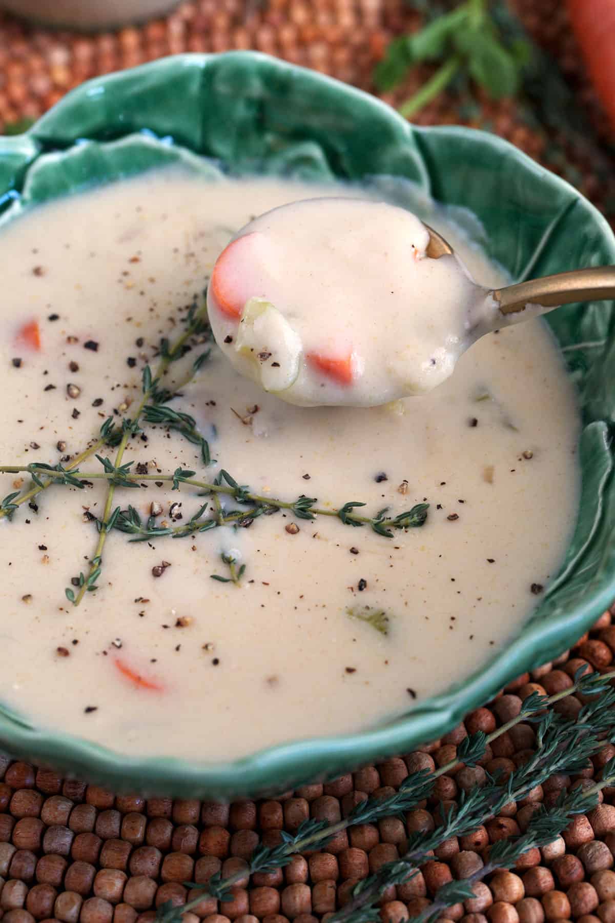 cream of chicken substitute in a cabbage bowl with a gold spoon.