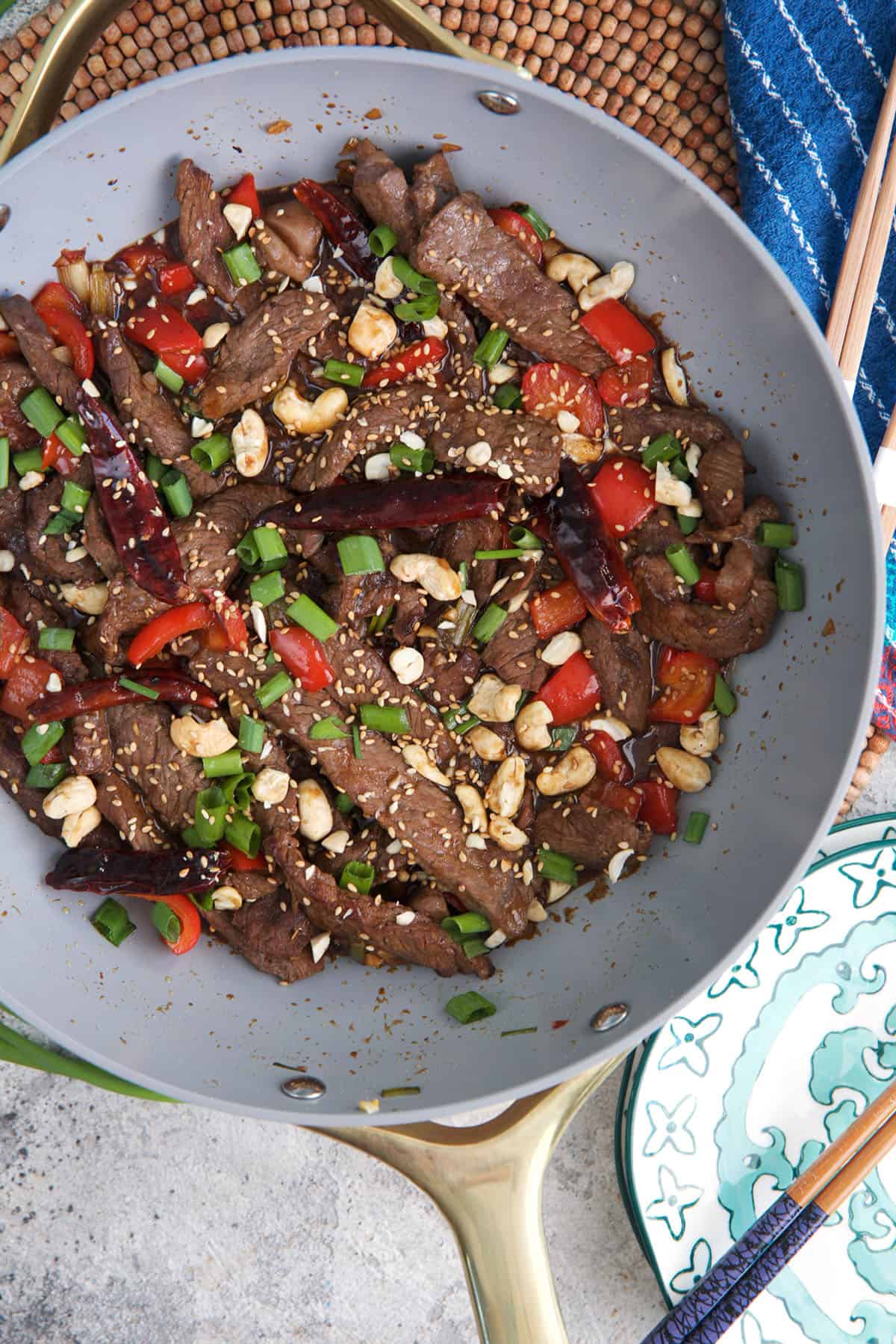 Kung Pao Beef in a stir fry skillet ready to serve after stir frying.