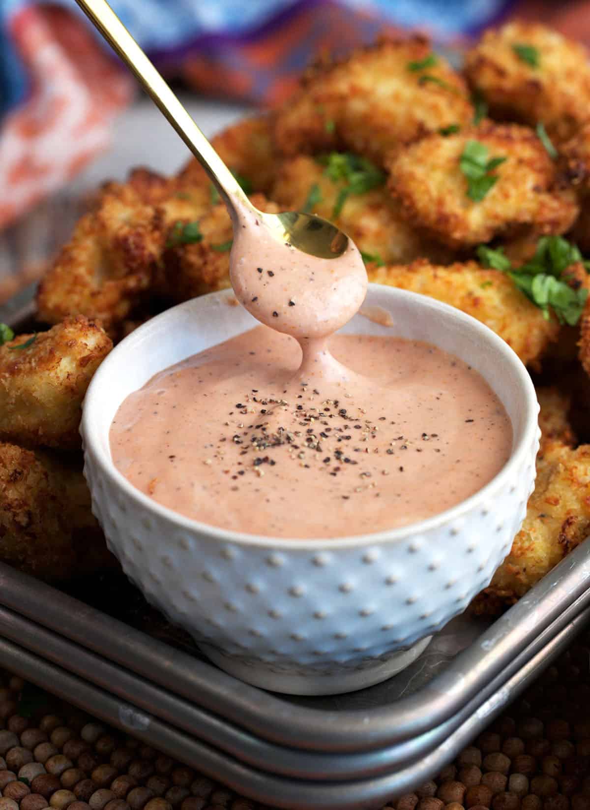 Canes Sauce in a white bowl with a serving spoon