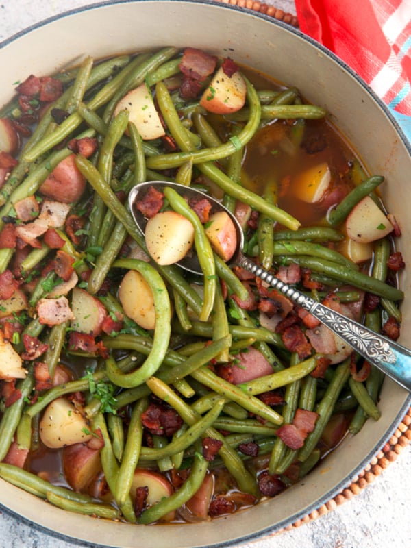 Southern green beans with potatoes and bacon in a stock pot after simmering for 30 minutes.