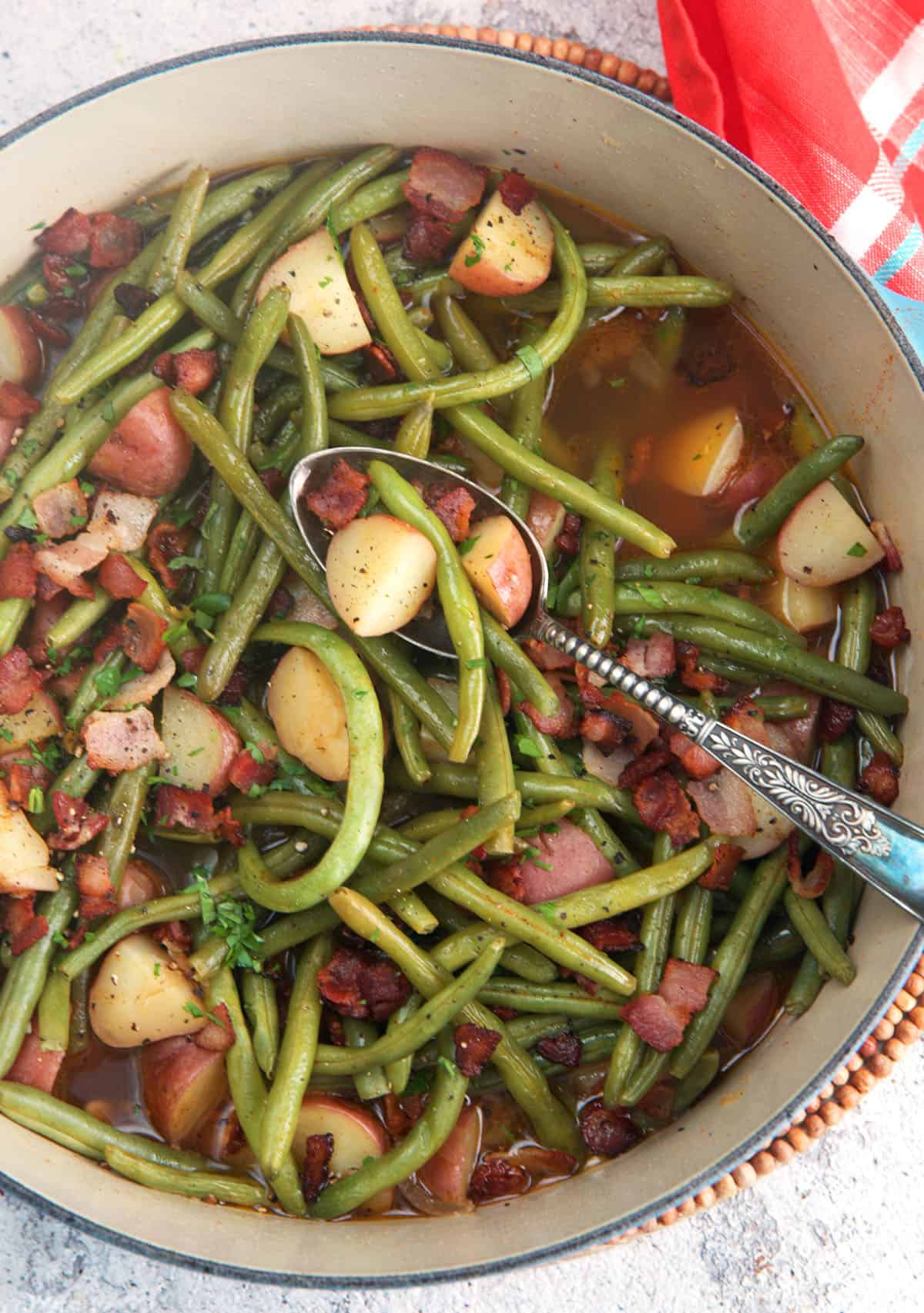 Southern green beans with potatoes and bacon in a stock pot after simmering for 30 minutes.