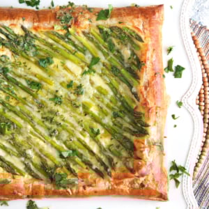 Asparagus Tart made with puff pastry and baked with gruyere cheese.