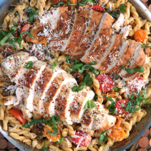 Bruschetta Chicken pasta in a large skillet ready to be served.