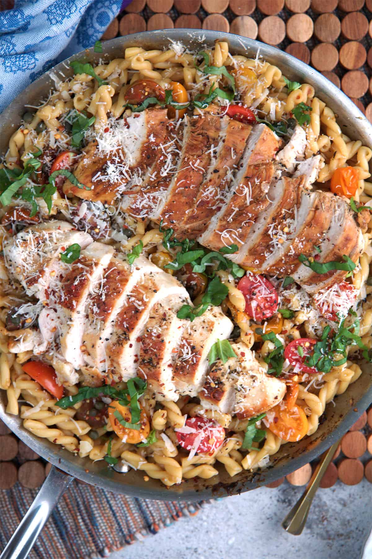 Bruschetta Chicken pasta in a large skillet ready to be served.