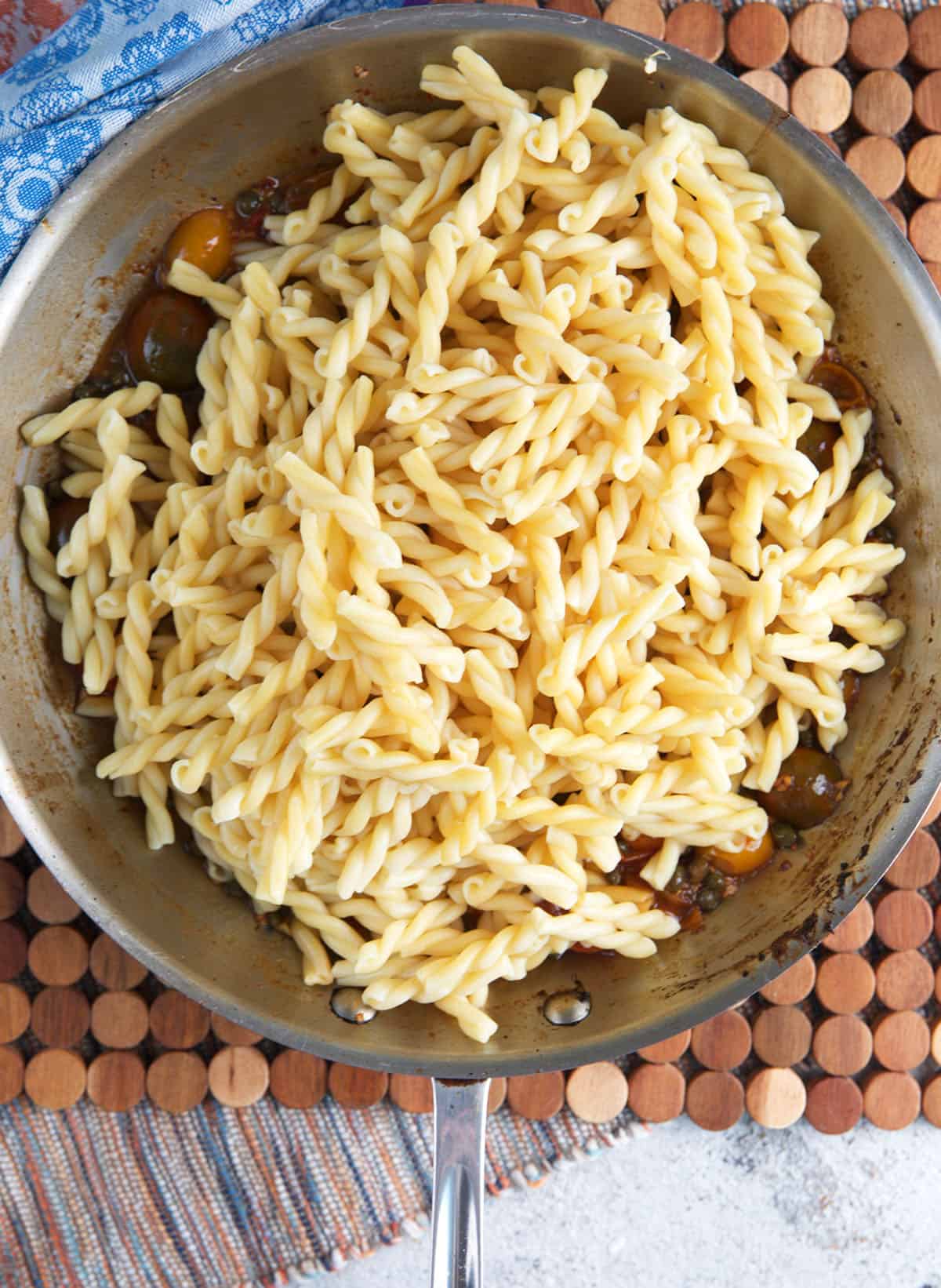 Pasta added to the sauce for bruschetta chicken pasta.