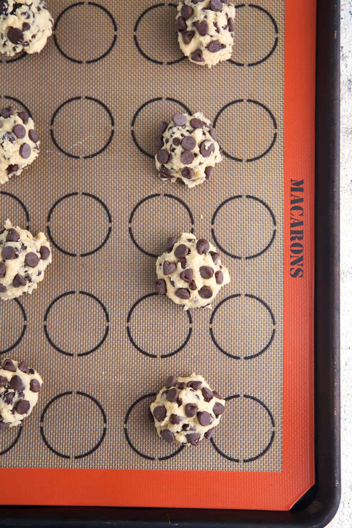 sourdough discard chocolate chip cookie dough on a baking sheet before baking.