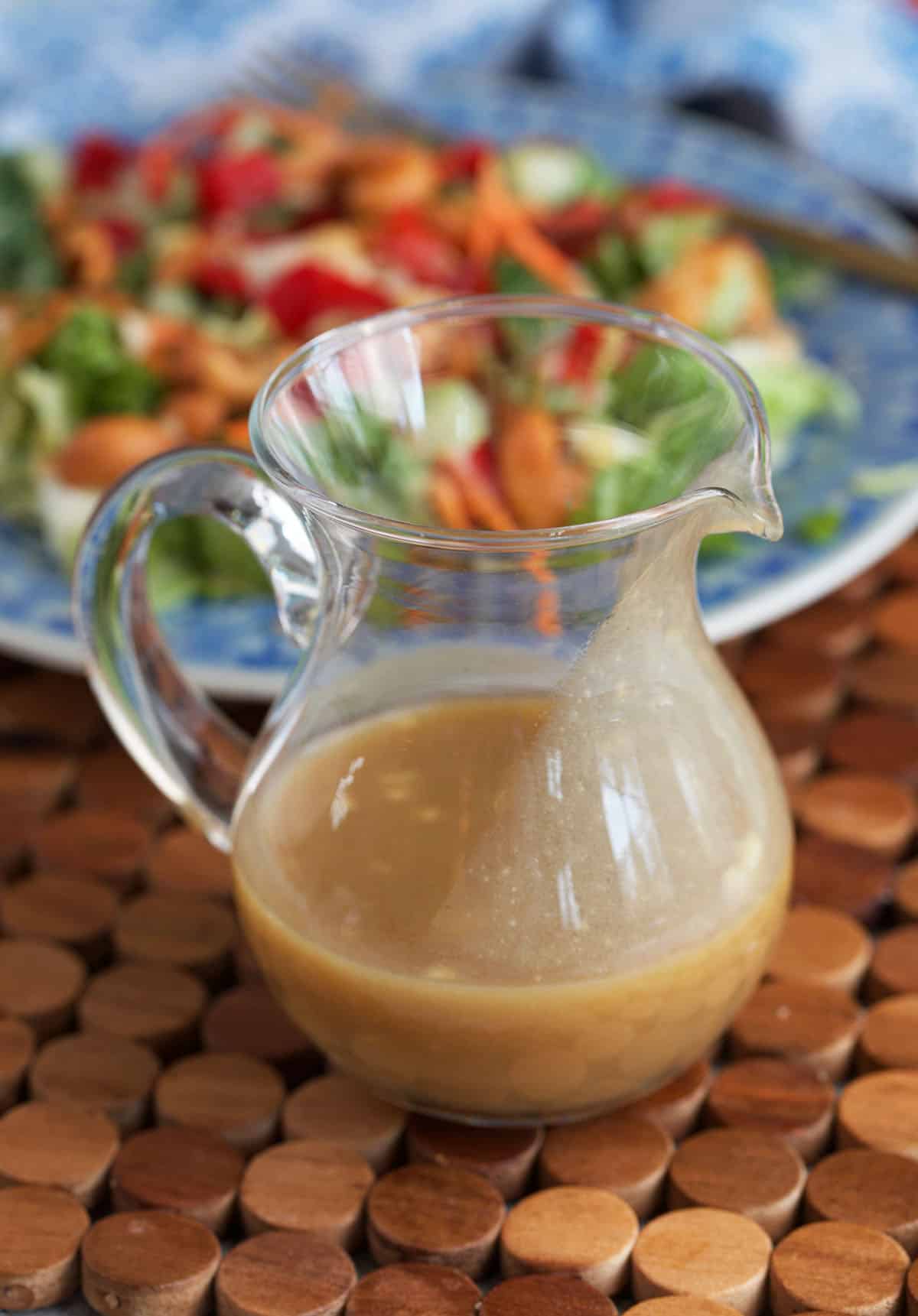 Miso ginger dressing in a pitcher ready to be served over a salad