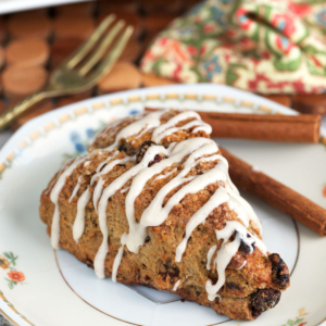 Sourdough scone with glaze on a white plate