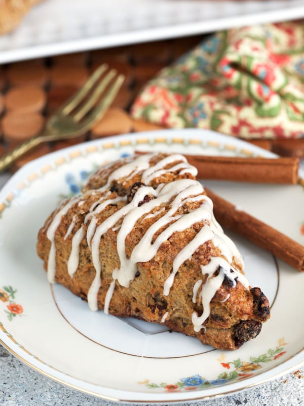 Sourdough scone with glaze on a white plate