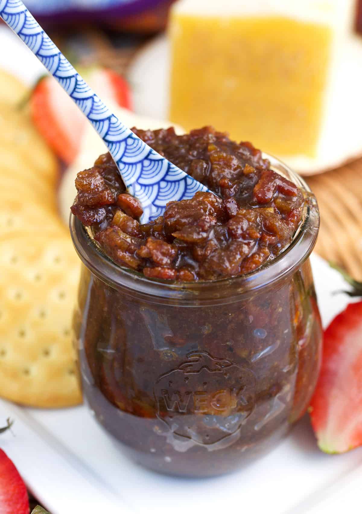 Bacon jam in a weck tulip jar with a blue and white floral spoon