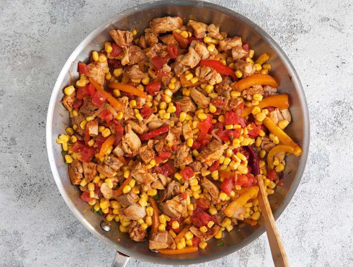 Chicken fajita casserole ingredients after being sautéed in a skillet