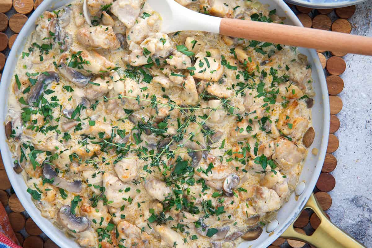 Chicken Stroganoff in a large skillet with a gold handle.